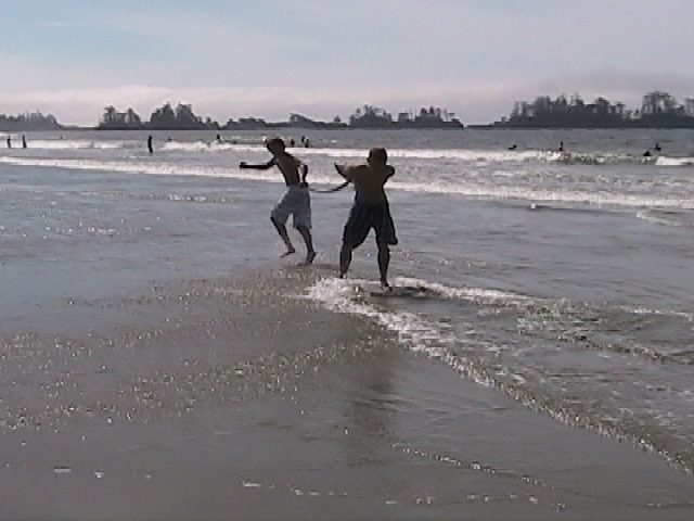 Skimboarding while being pulled.