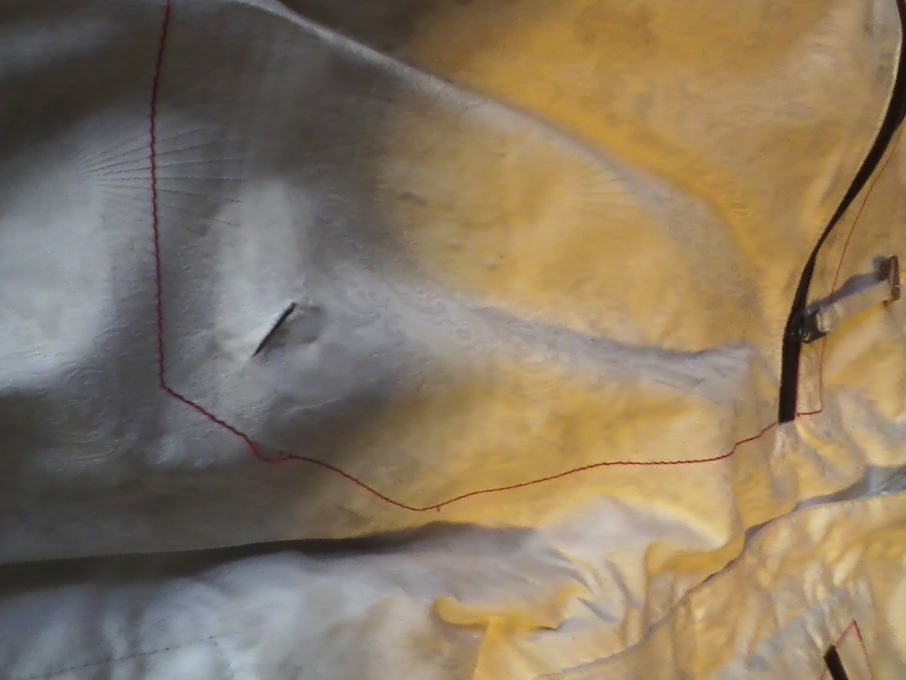 Small tear on left pocket, Not all the way threw