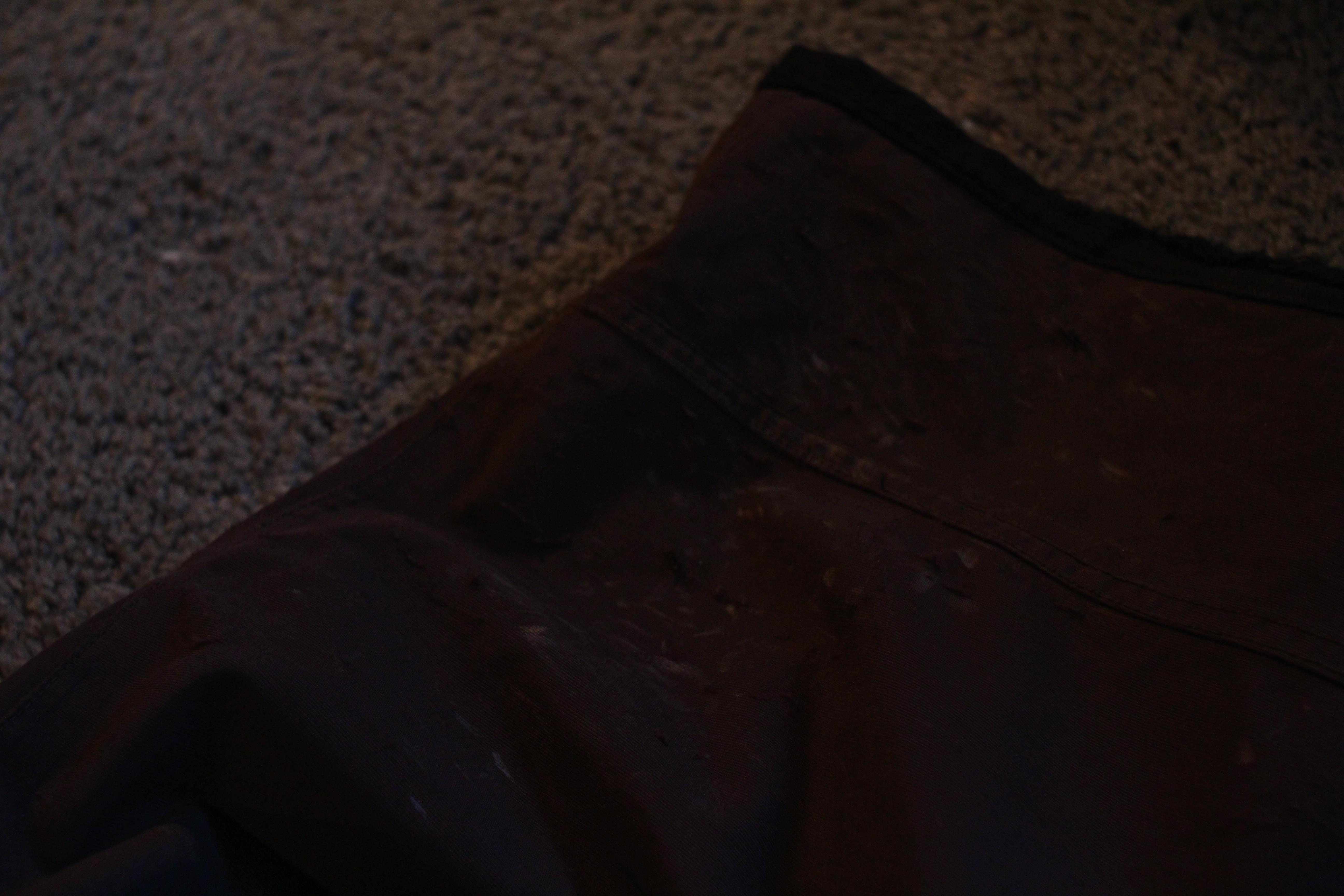 Small wear on right leg