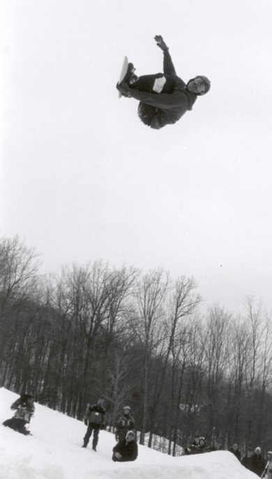 Snowboarder going Huge