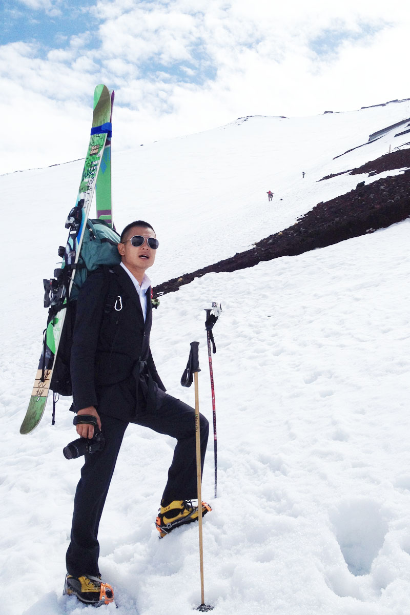 Suit guy in Top of winter Fujiyama 