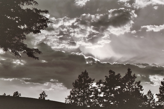 Sun shining from behind clouds