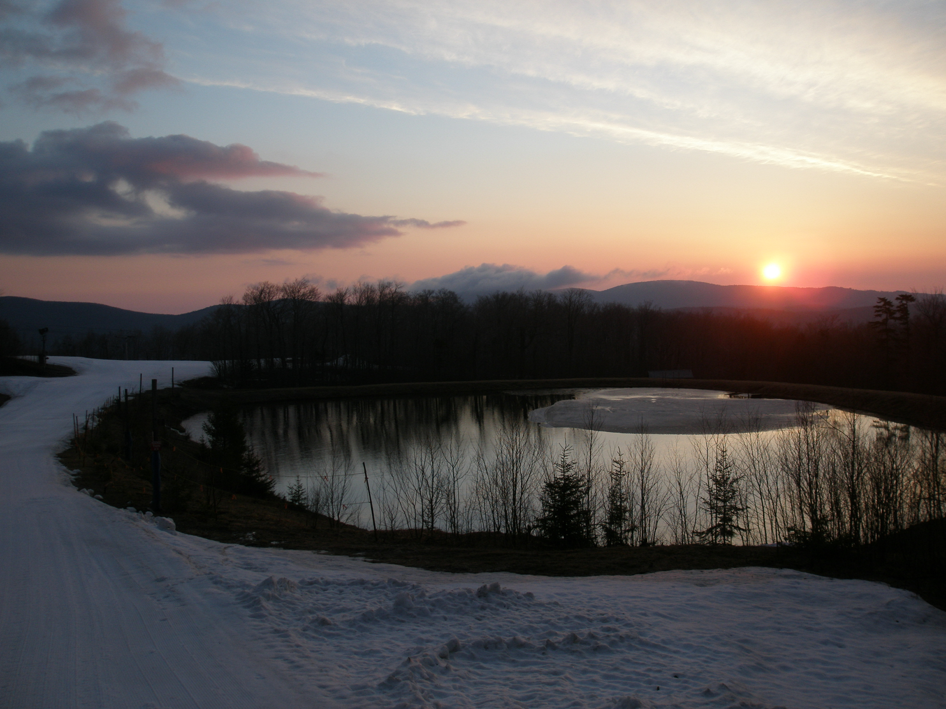Sunrise over snowmaking pond
