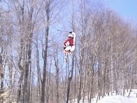 tail grab over a hip