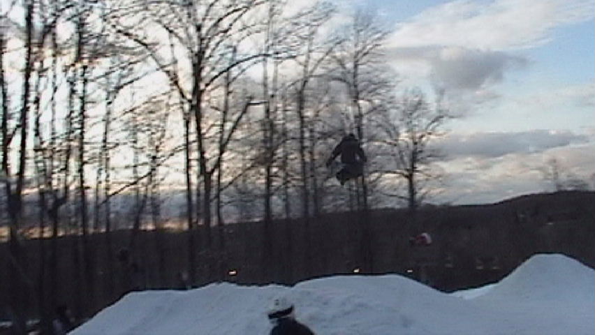 Tail Grab over the Hip