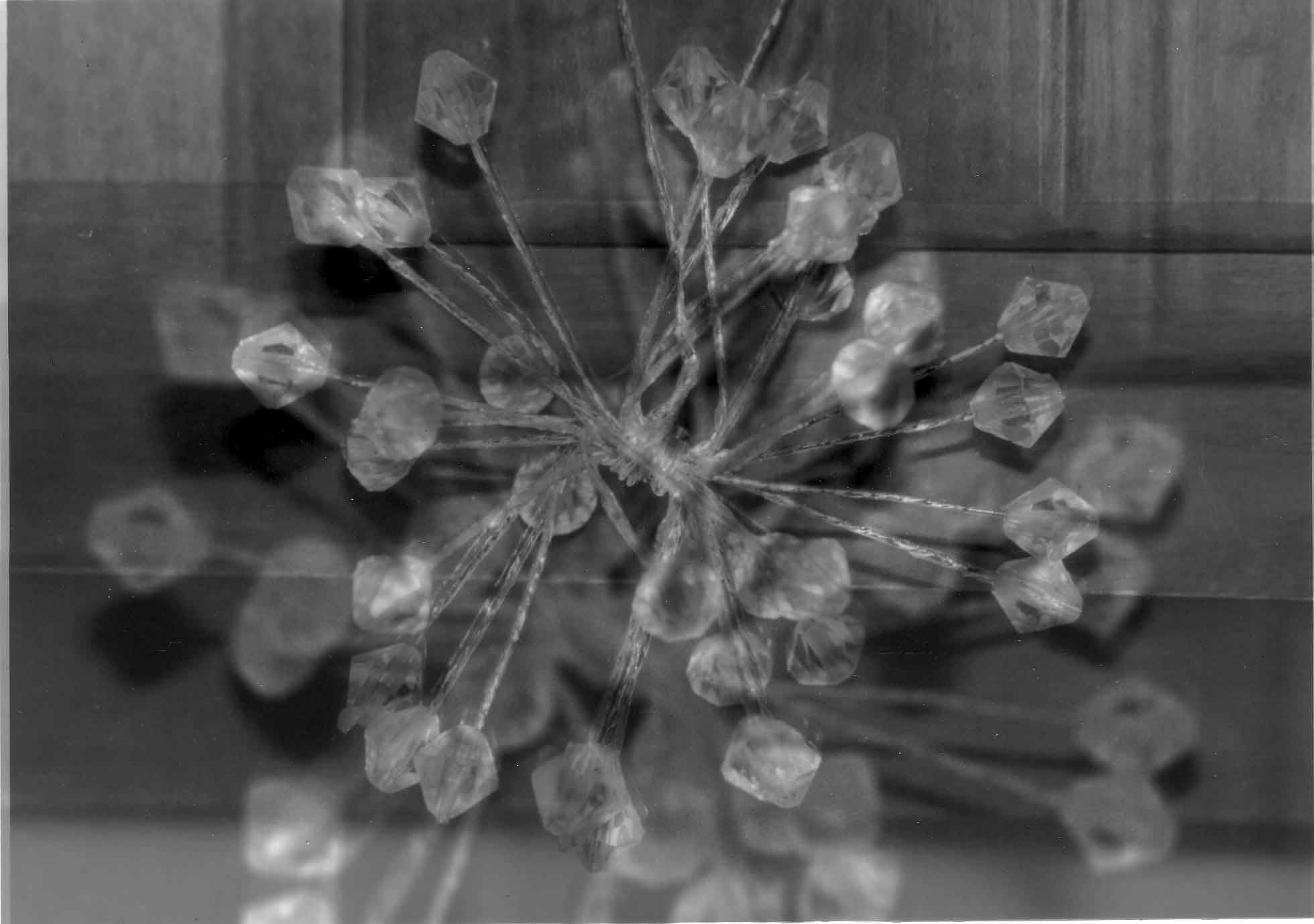 Transformation: Holiday decoration printed twice, once in focus and once blurry and big