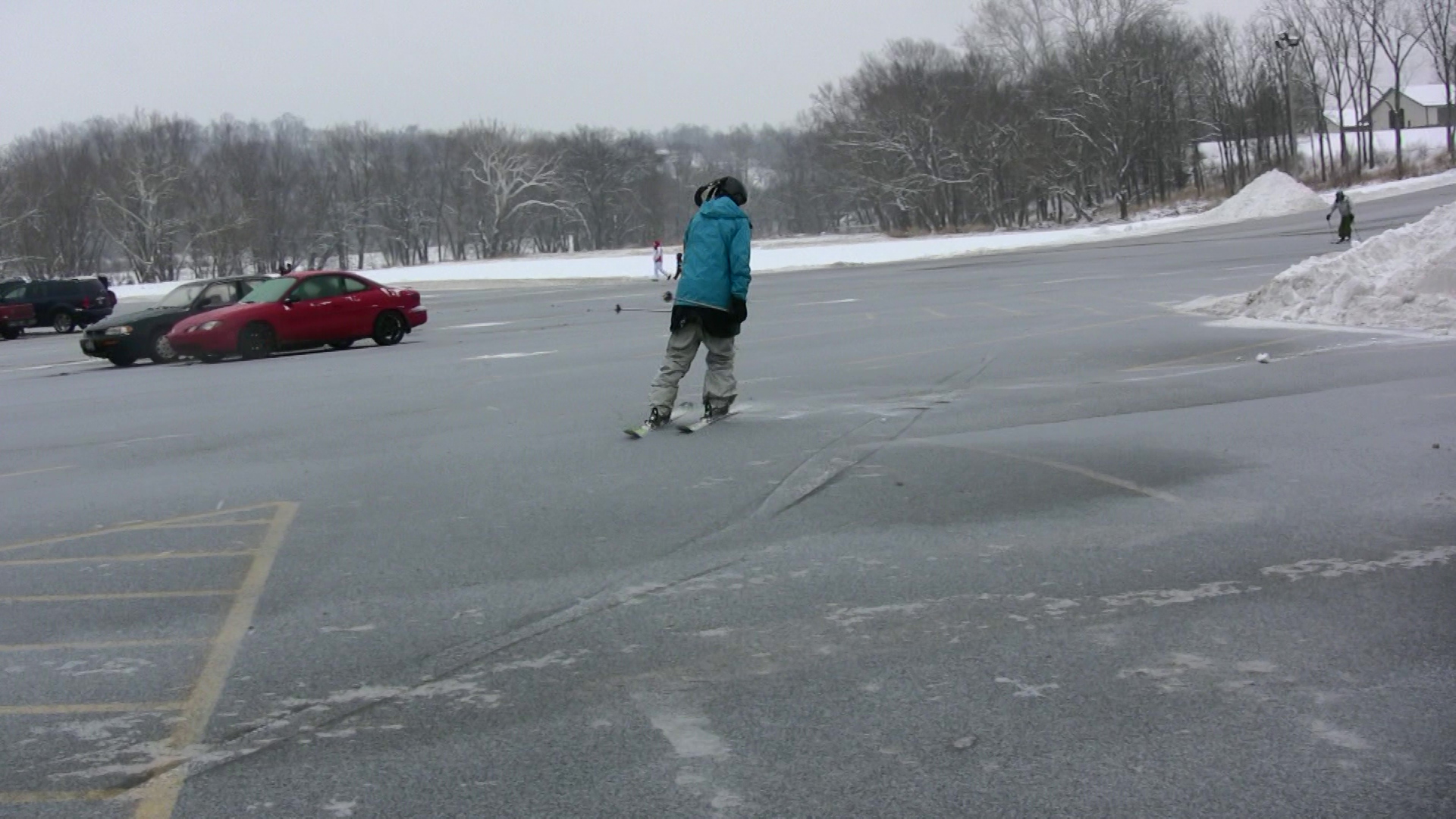 Video still: skiing in the parking lot